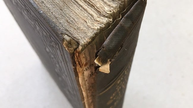 Cloth covered binding repair
