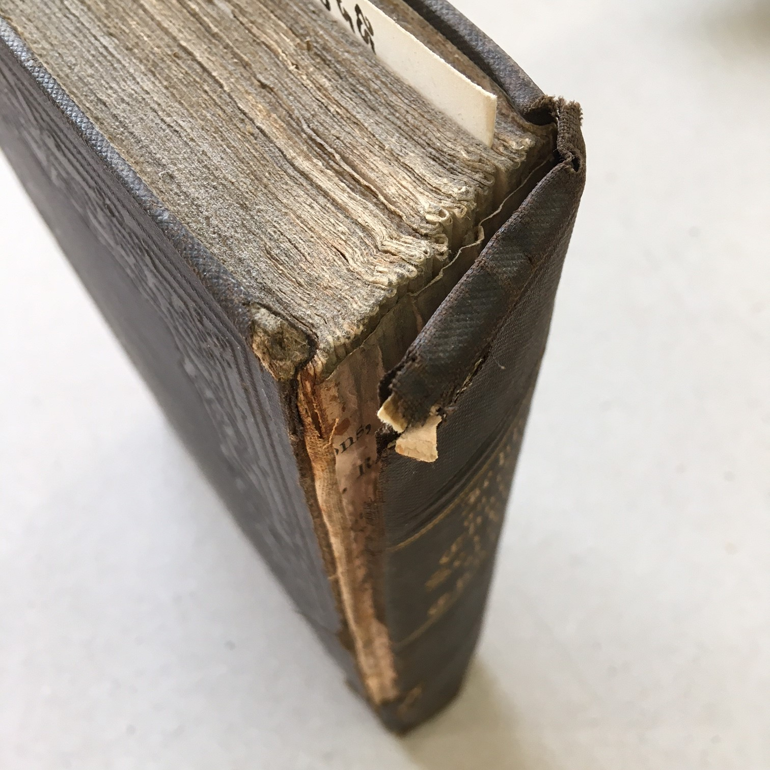 Cloth covered binding repair
