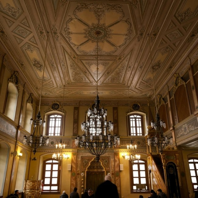 Elegant historic interior with ornate chandeliers